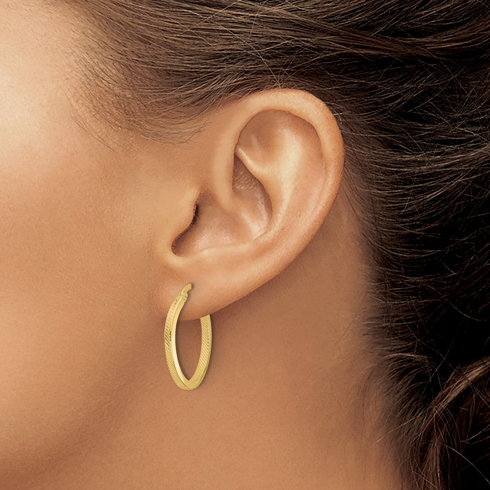 10K Polished and Textured Oval Hoop Earrings