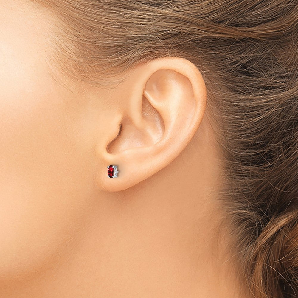 Sterling Silver Rhodium-plated 5x3mm Oval Garnet Post Earrings