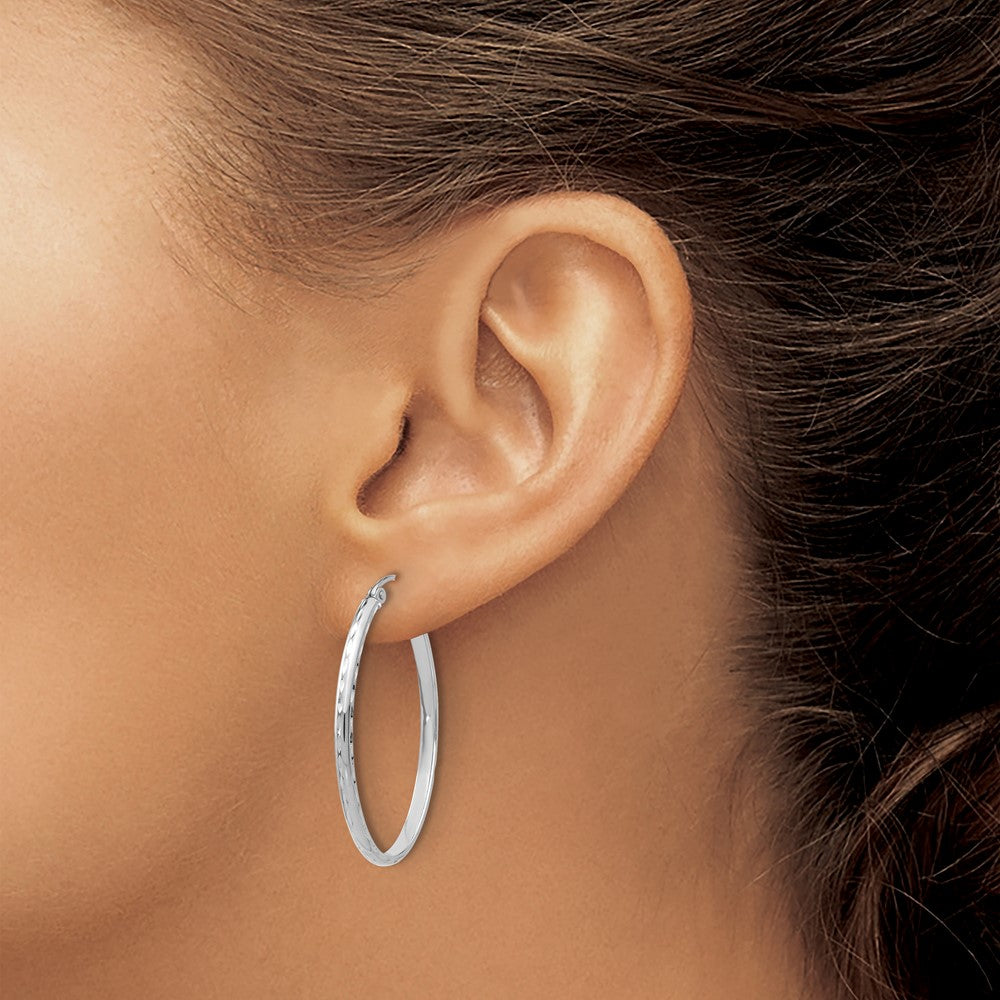 14k White Gold 2.5x35mm Lightweight Diamond-cut Oval Tube Hoop Earrings
