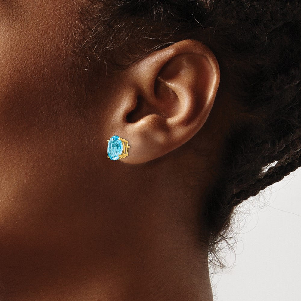 14k 9x7mm Oval Blue Topaz Post Earrings